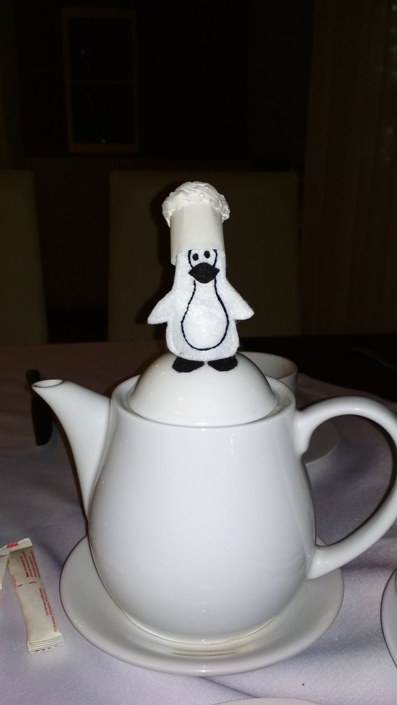 Flat Friend penguin on tea pot
