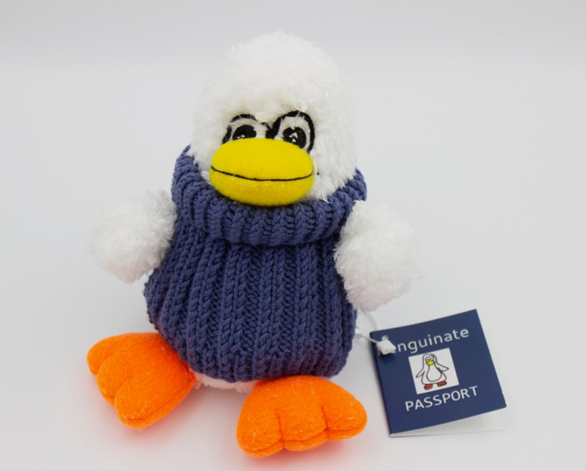 Periwinkle Penguin - white stuffed penguin in blue handknit sweater